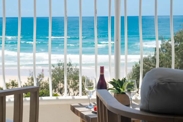 Morning drinks on the balcony, the surf right there
